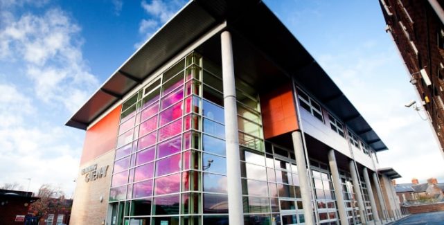 A building with a colorful glass facade.