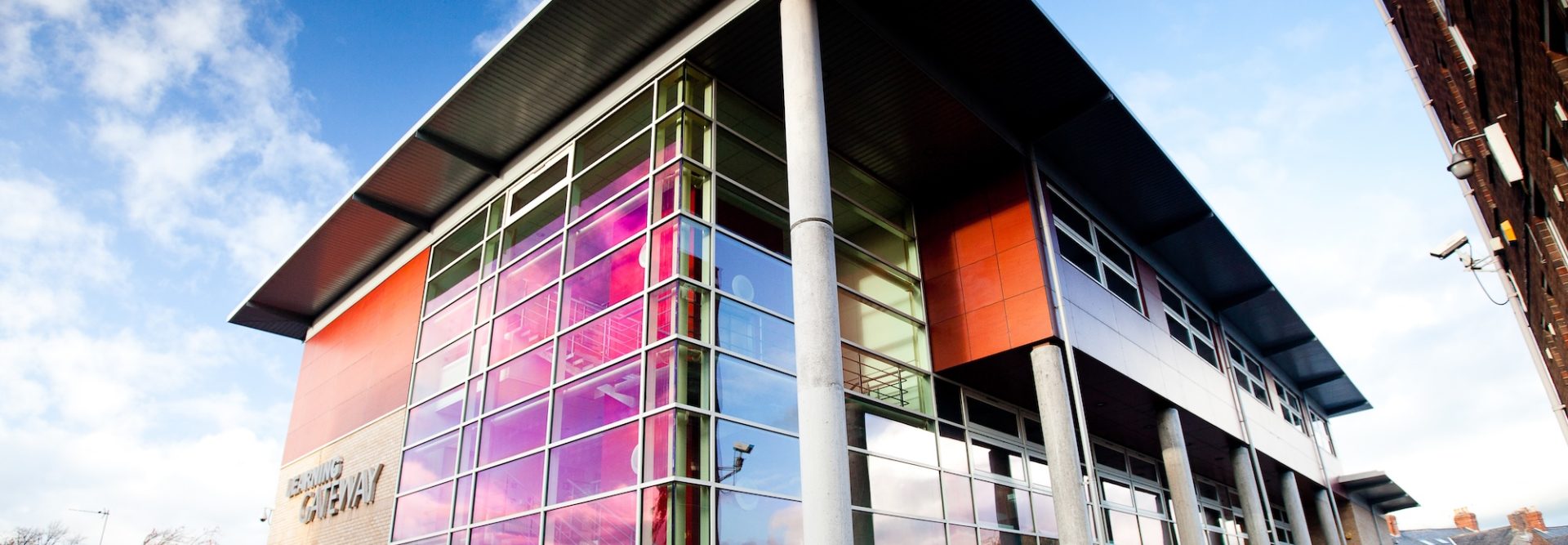 A building with a colorful glass facade.