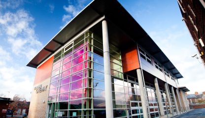 A building with a colorful glass facade.